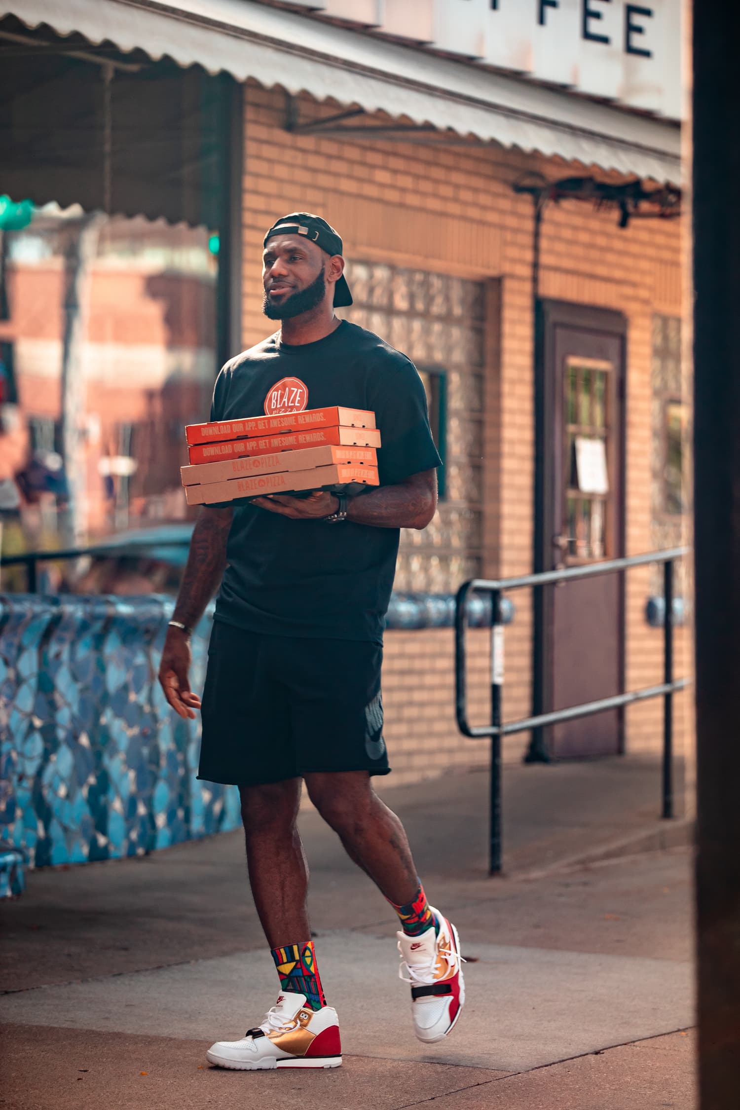 LeBron James carrying Blaze Pizza boxes